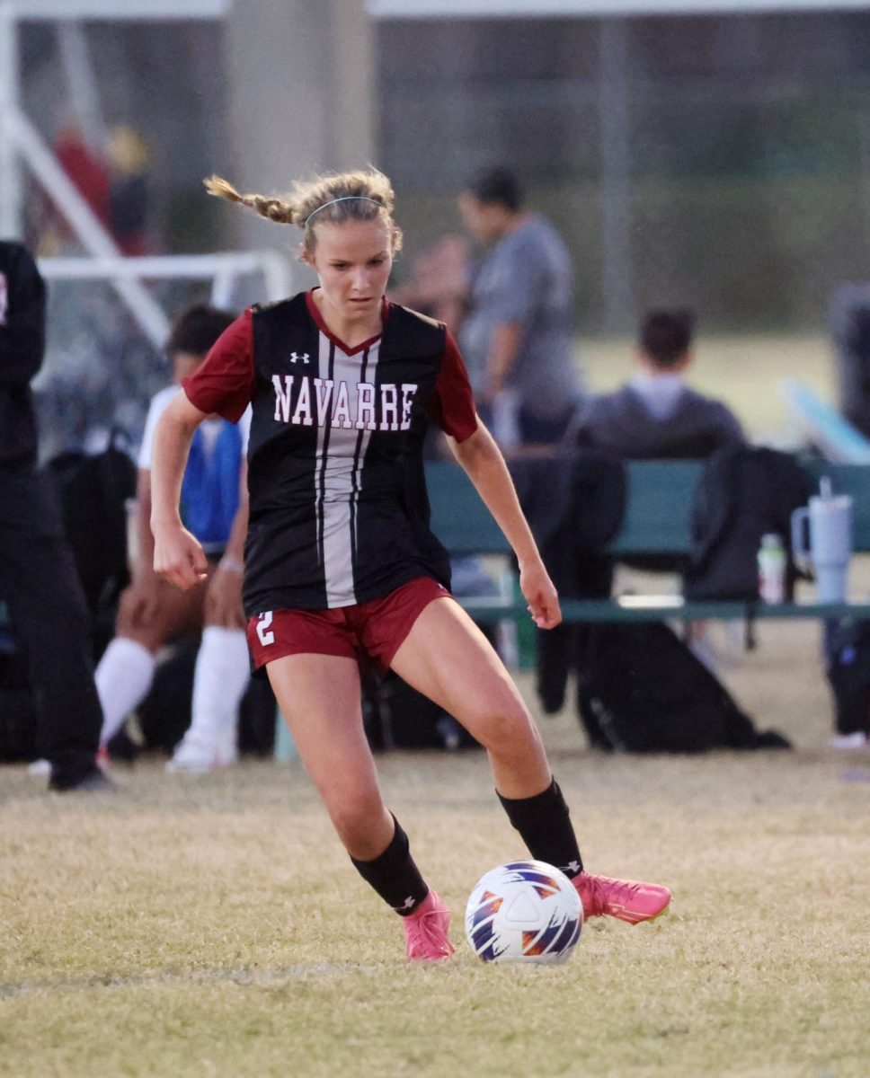 Ashlyn+Richardson%2C+a+Navarre+High+School+sophomore%2C+dribbles+the+ball+at+midfield+in+a+match+against+West+Florida+High+School.